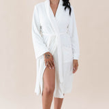 Model wearing the Adult Robe in Cloud with one hand on her thigh