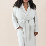 Model wearing the Adult Robe in Oat with one hand in pocket