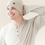 Man modeling Chunky Knit Ribbed Beanie in Almond
