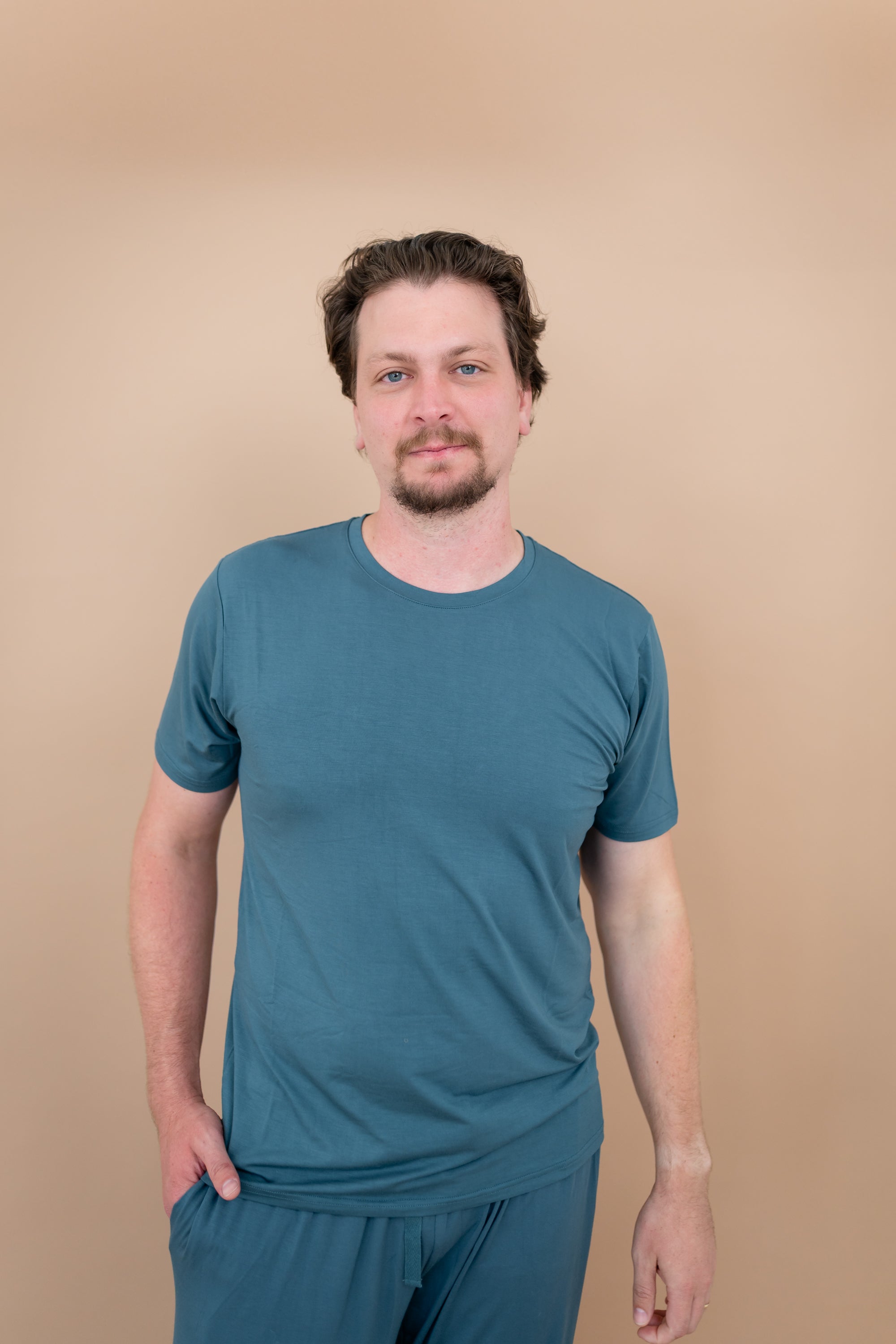 Male model wearing Men's Crew Neck Tee in Atlantic and matching lounge pants