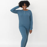 Model with one hand in her hear while wearing the Women’s Ribbed Henley Set in Atlantic