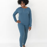 Smiling model wearing the Women’s Ribbed Henley Set in Atlantic with one hand on her hip