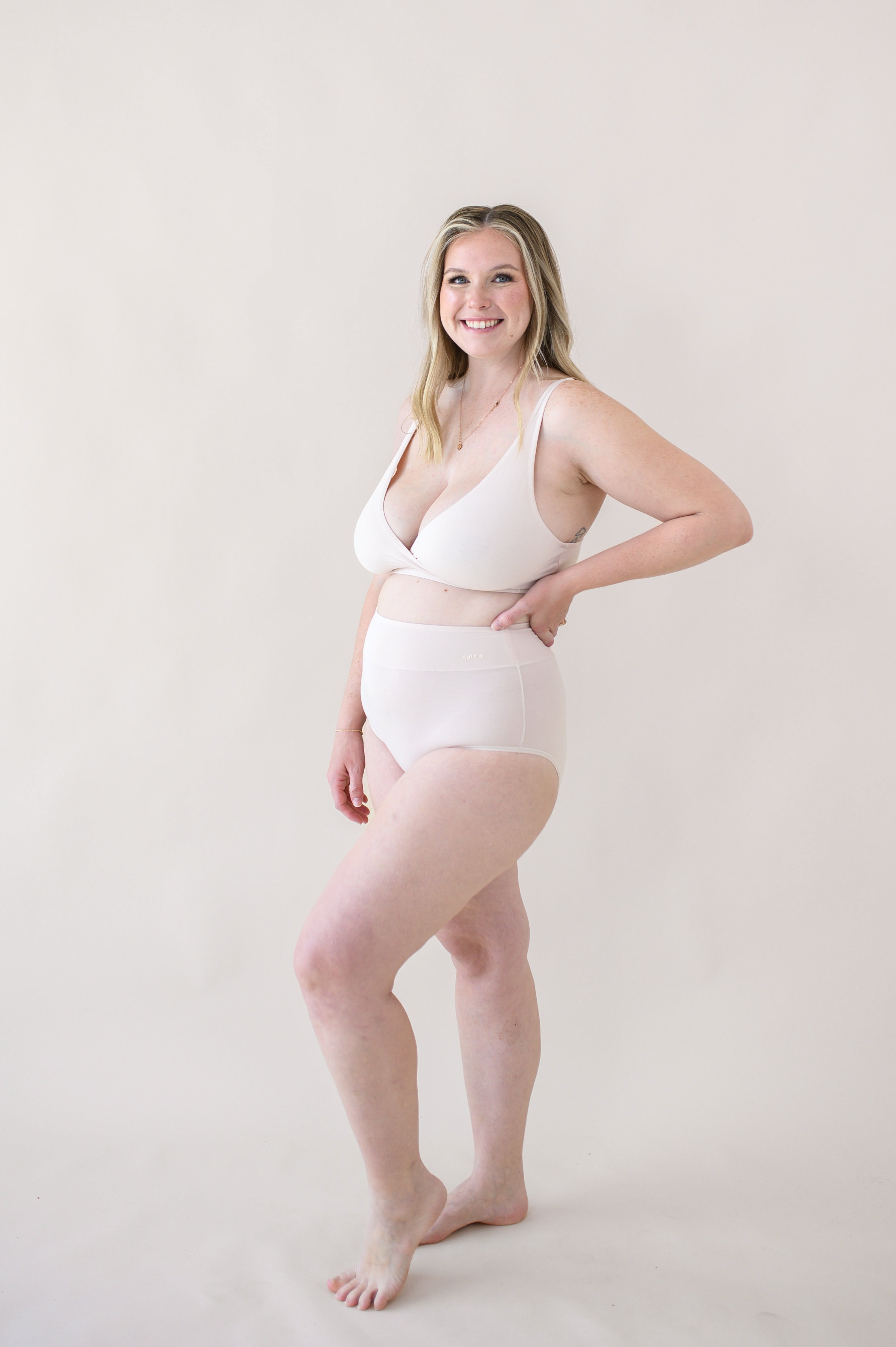 Woman modeling Women's High-Waisted Brief in Blonde and Cross Front Bralette