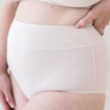 Woman modeling Women's High-Waisted Brief in Blonde and Cross Front Bralette