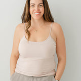 Female model wearing the Women’s Camisole in Blush and tan pants