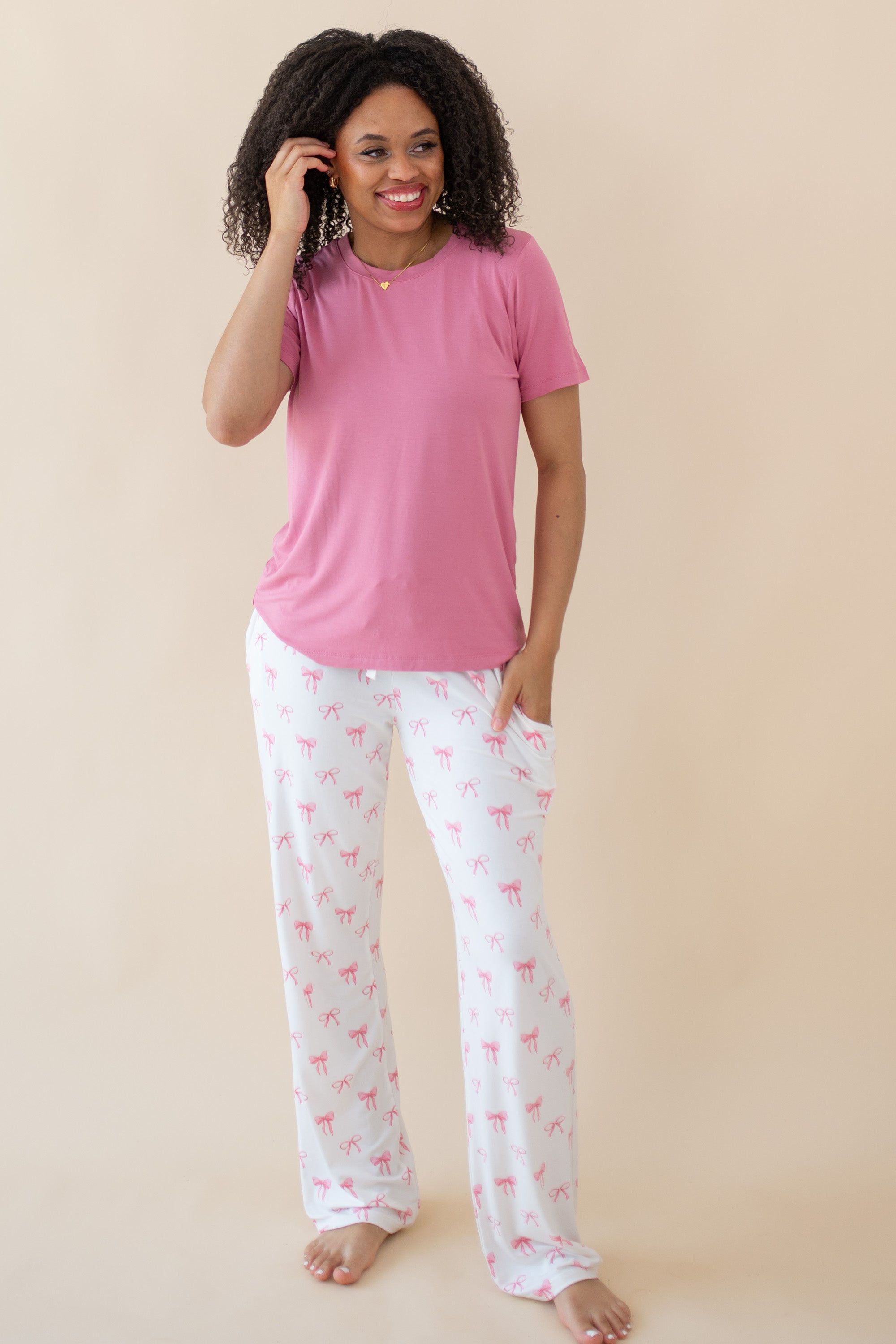 Woman modeling Women's Lounge Pants in Bow and Apple Blossom tee