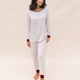 Model looking to the side while wearing the Women's RIbbed Henley Set in Burgundy Stripe
