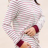 Close up of the Women's RIbbed Henley Set in Burgundy Stripe displaying the cuffs and pocket on bottoms