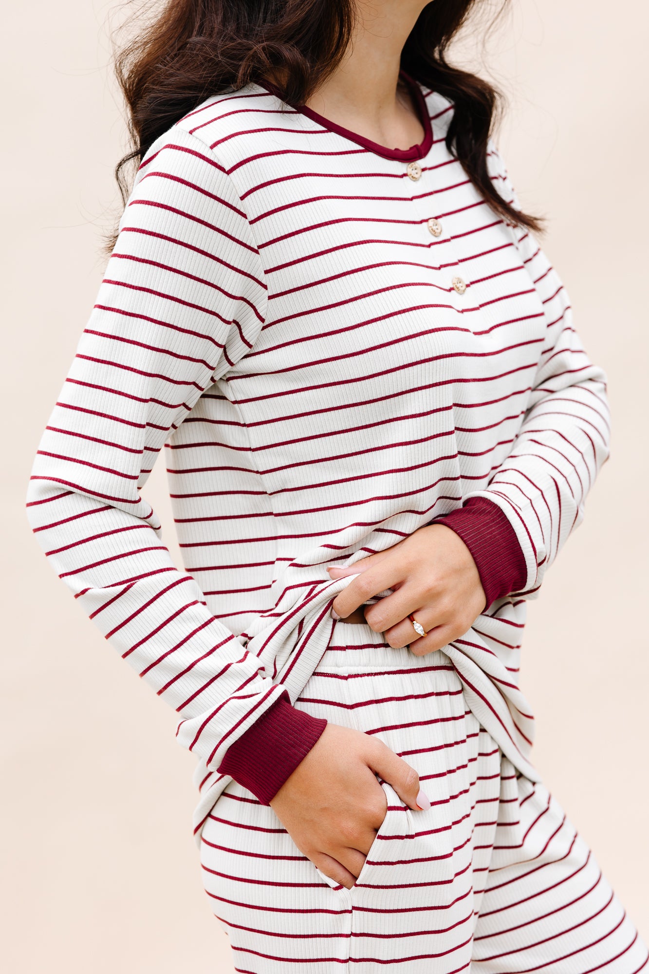Close up of the Women's RIbbed Henley Set in Burgundy Stripe displaying the cuffs and pocket on bottoms