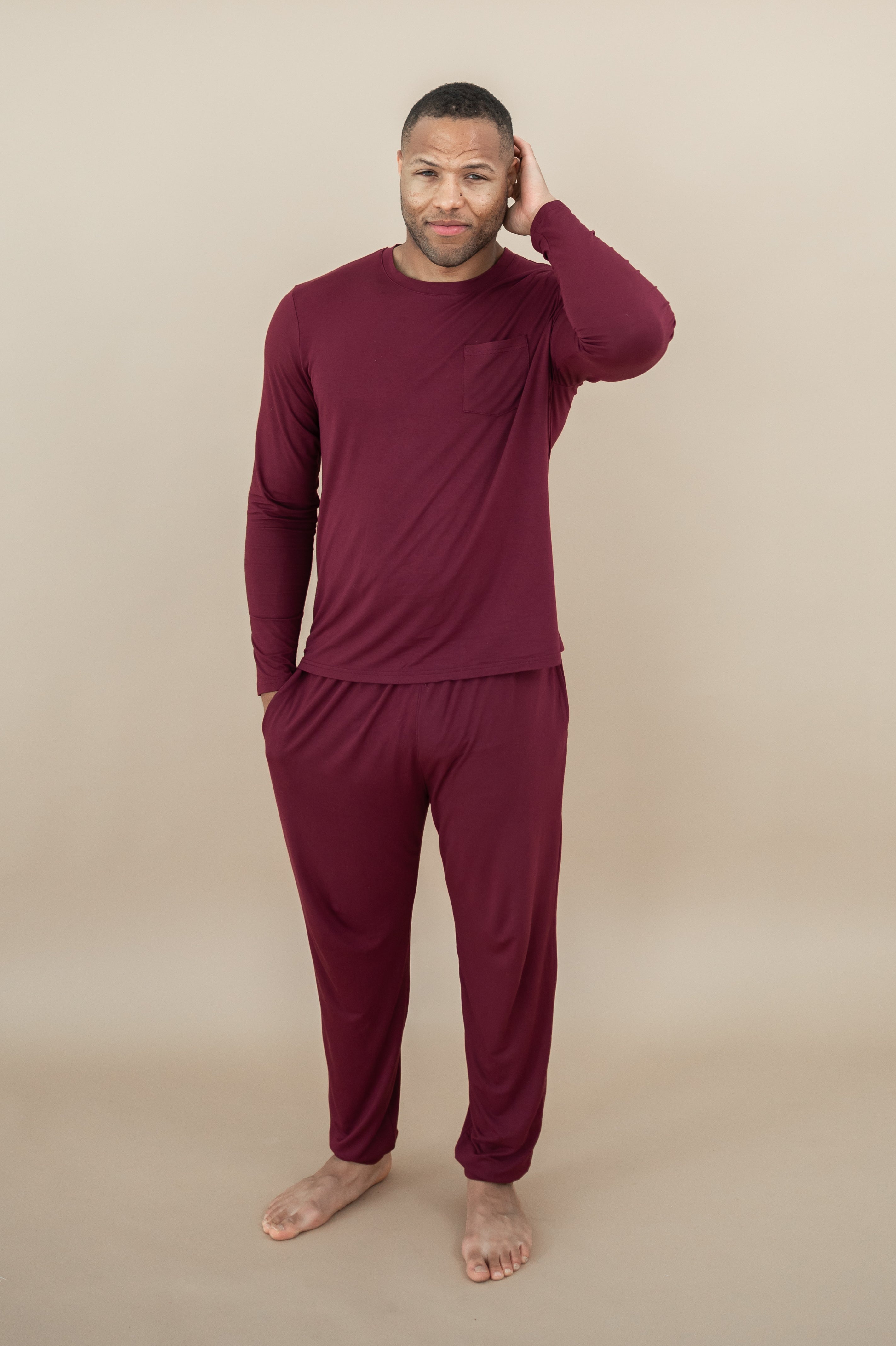 Male model wearing Men's Jogger Set in Burgundy