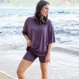 Female standing in the sand wearing the Women’s Biker Short Set in Currant