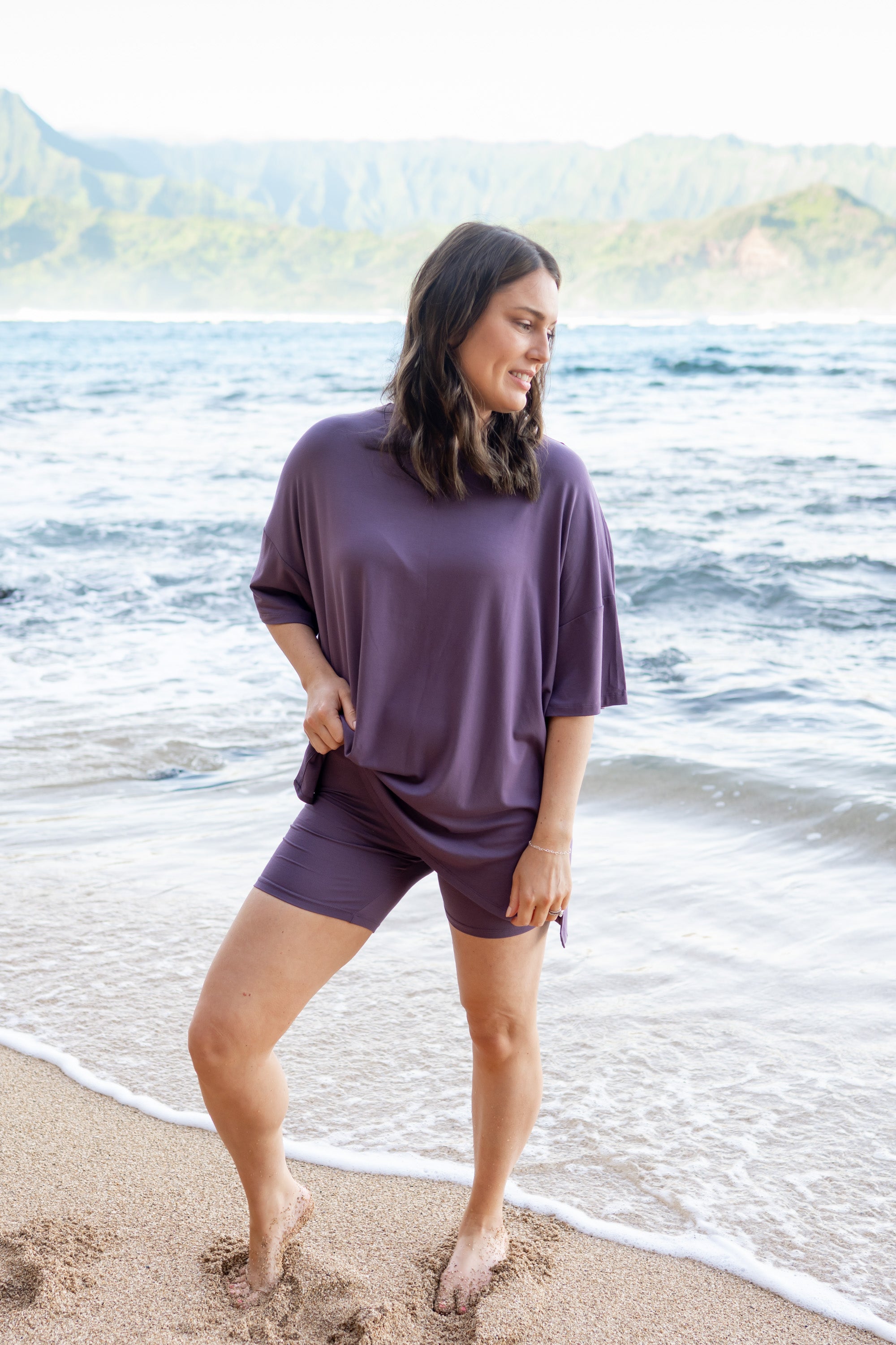 Female standing in the sand wearing the Women’s Biker Short Set in Currant