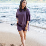 Female model standing in the sand on the beach wearing the Women’s Biker Short Set in Currant