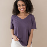 Female model wearing the Women’s Relaxed Fit V-Neck in Currant