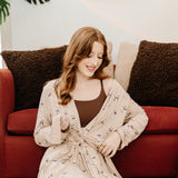 Model tying the tie on the Women's Lounge Robe in Espresso Martini