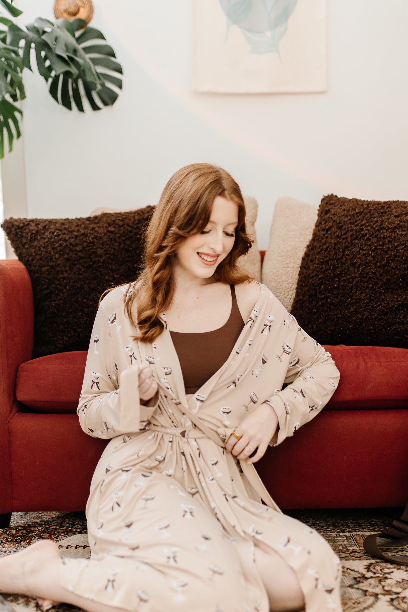 Model tying the tie on the Women's Lounge Robe in Espresso Martini