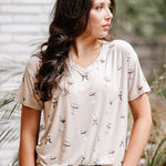 Woman looking to the side while modeling the Women's Relaxed Fit V-Neck in Espresso Martini