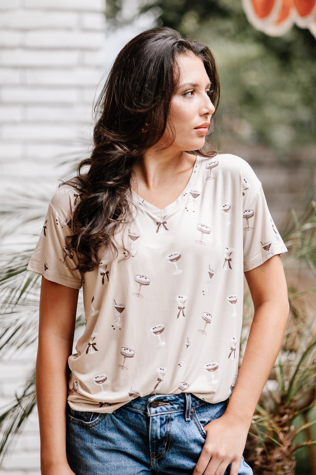 Woman looking to the side while modeling the Women's Relaxed Fit V-Neck in Espresso Martini