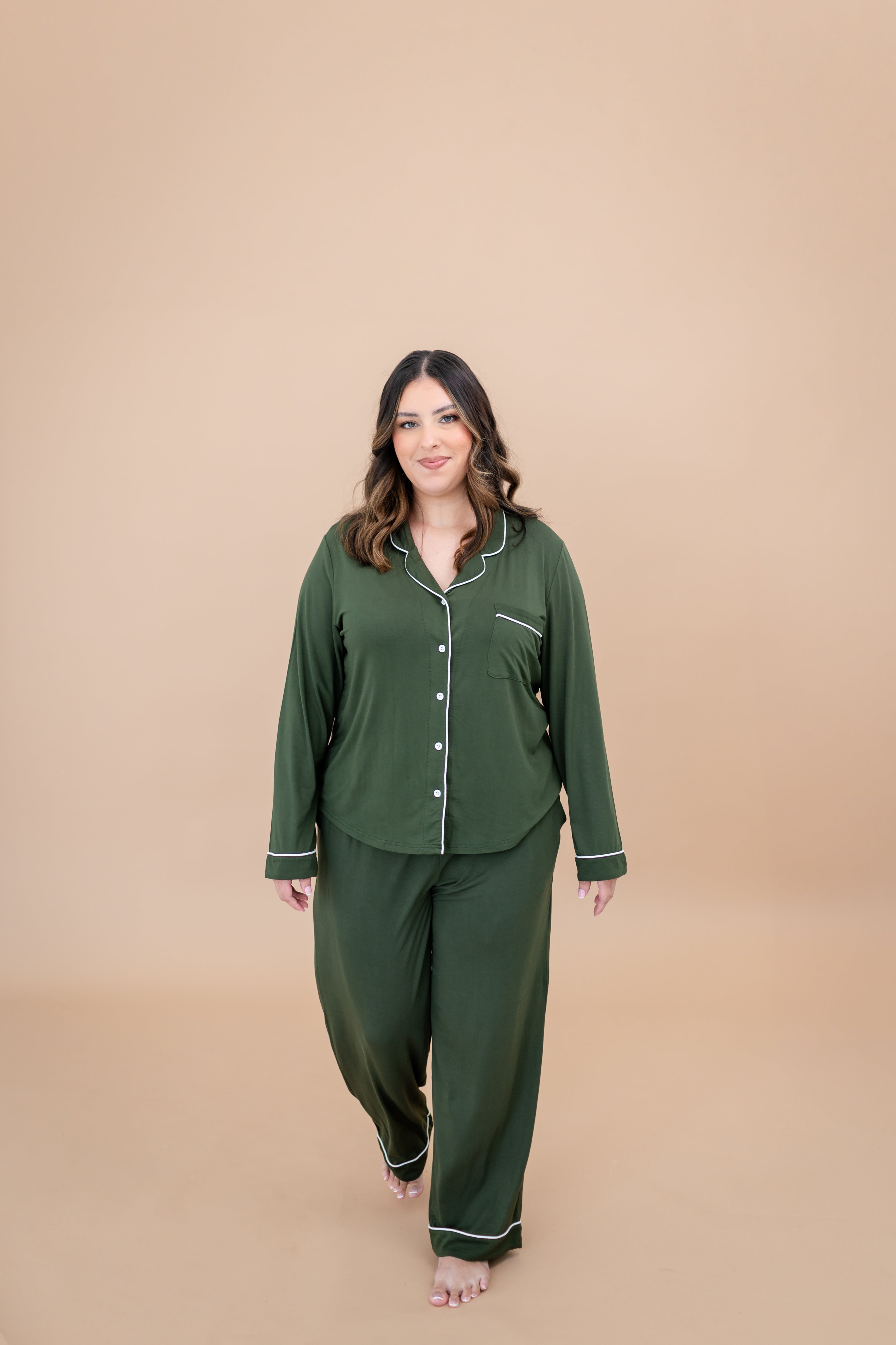 Model walking towards camera while wearing the Women's Long Sleeve Pajama Set in Fir