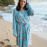 Model on the beach wearing the Women’s Lounge Robe in Hibiscus