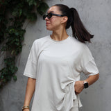 Woman modeling Women’s Biker Short Set in Oat accessorized with sunglasses and jewelry