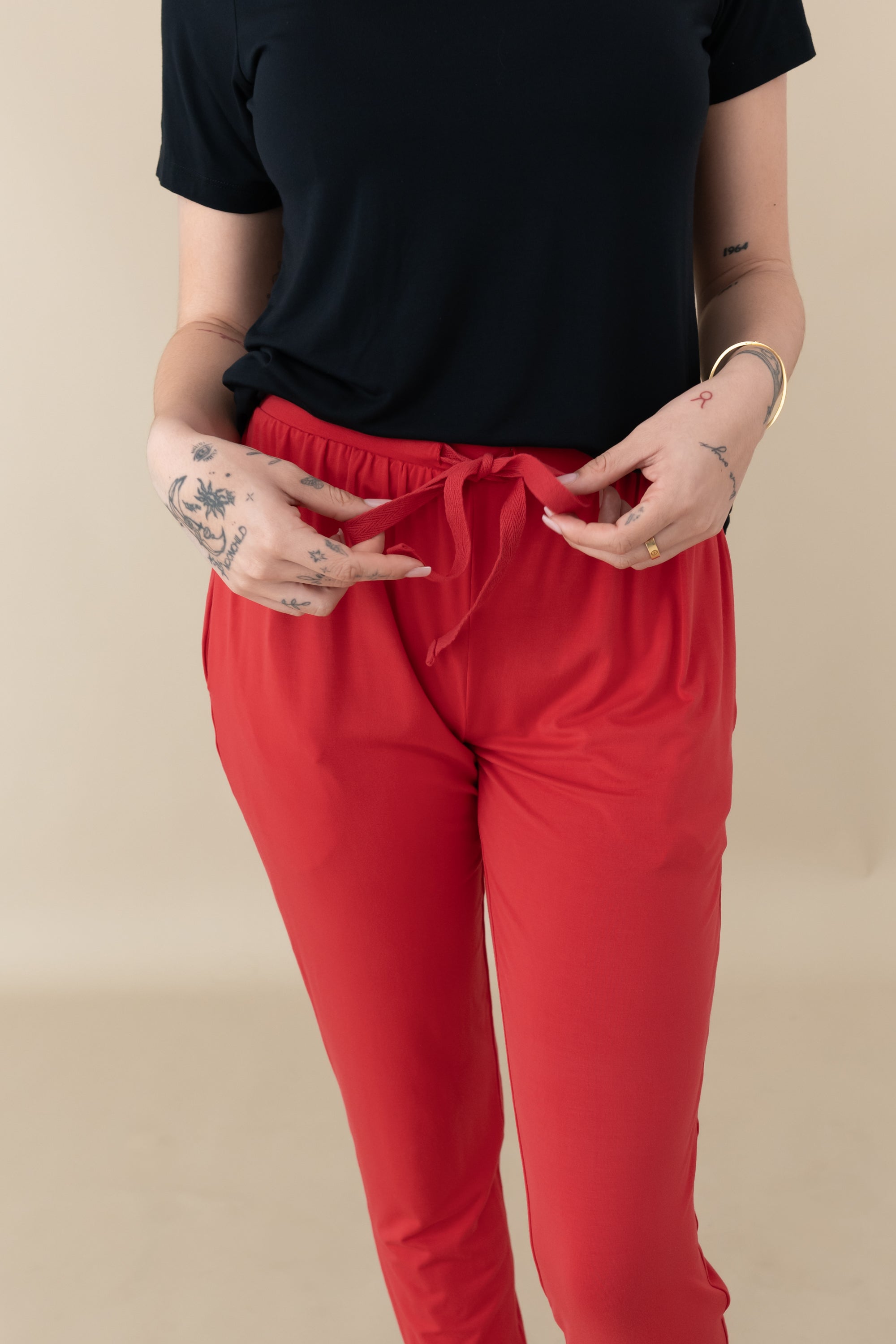 Woman modeling Women's Jogger Pants in Cardinal close up of waist tie