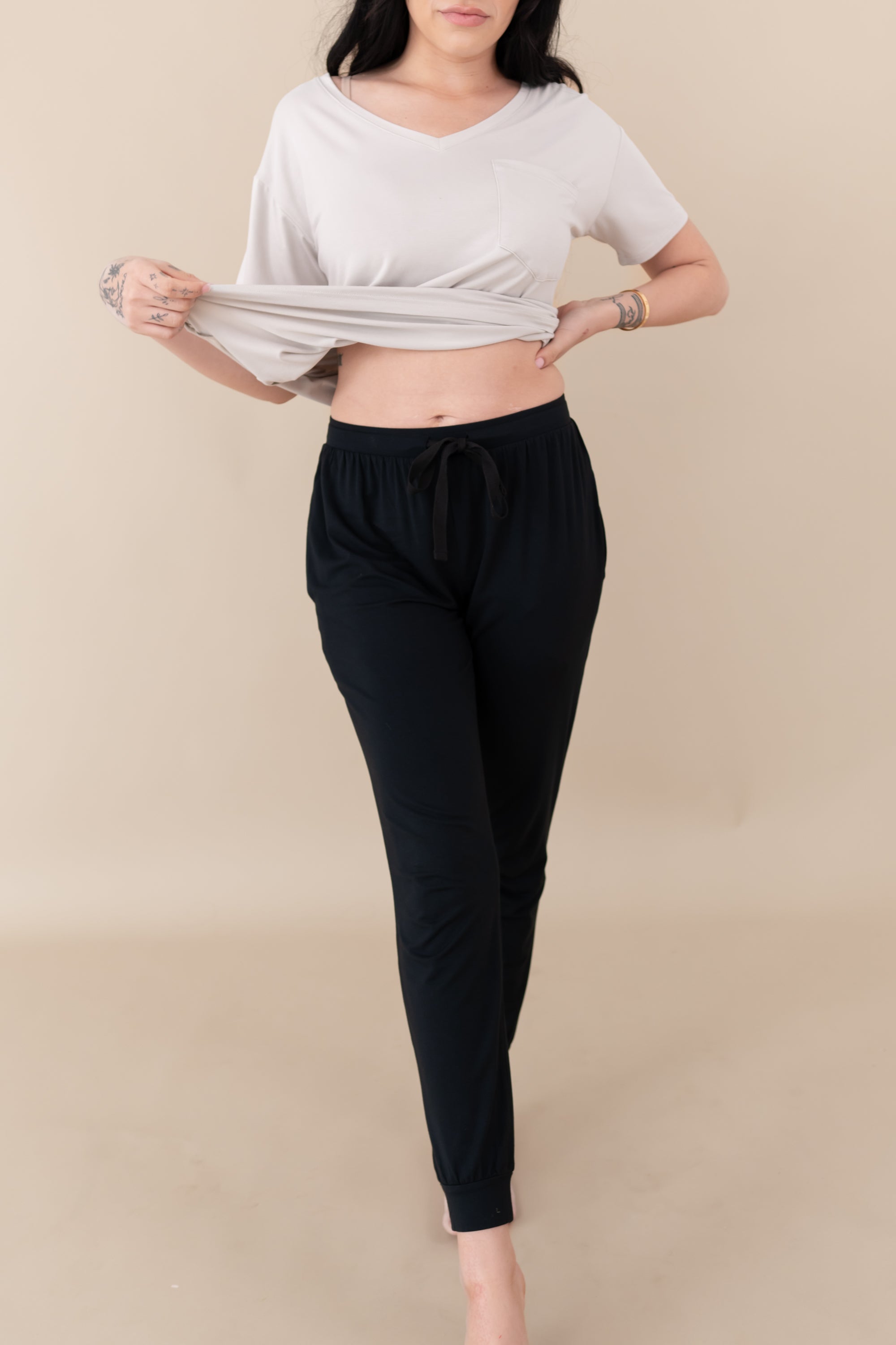 Woman modeling Women's Jogger Pants in Midnight showing off waist band