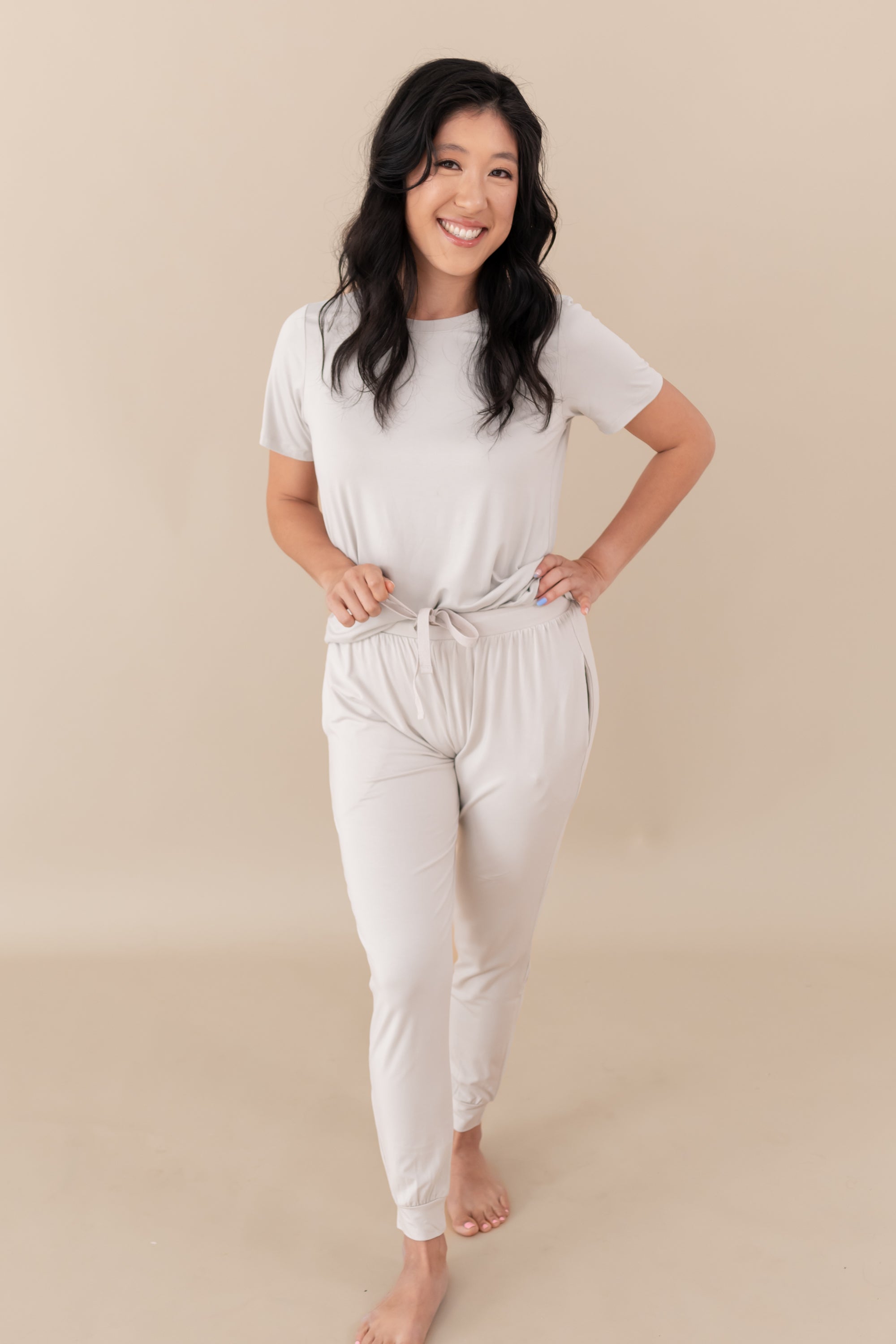 Woman modeling Women's Jogger Pants in Oat with hand on hip