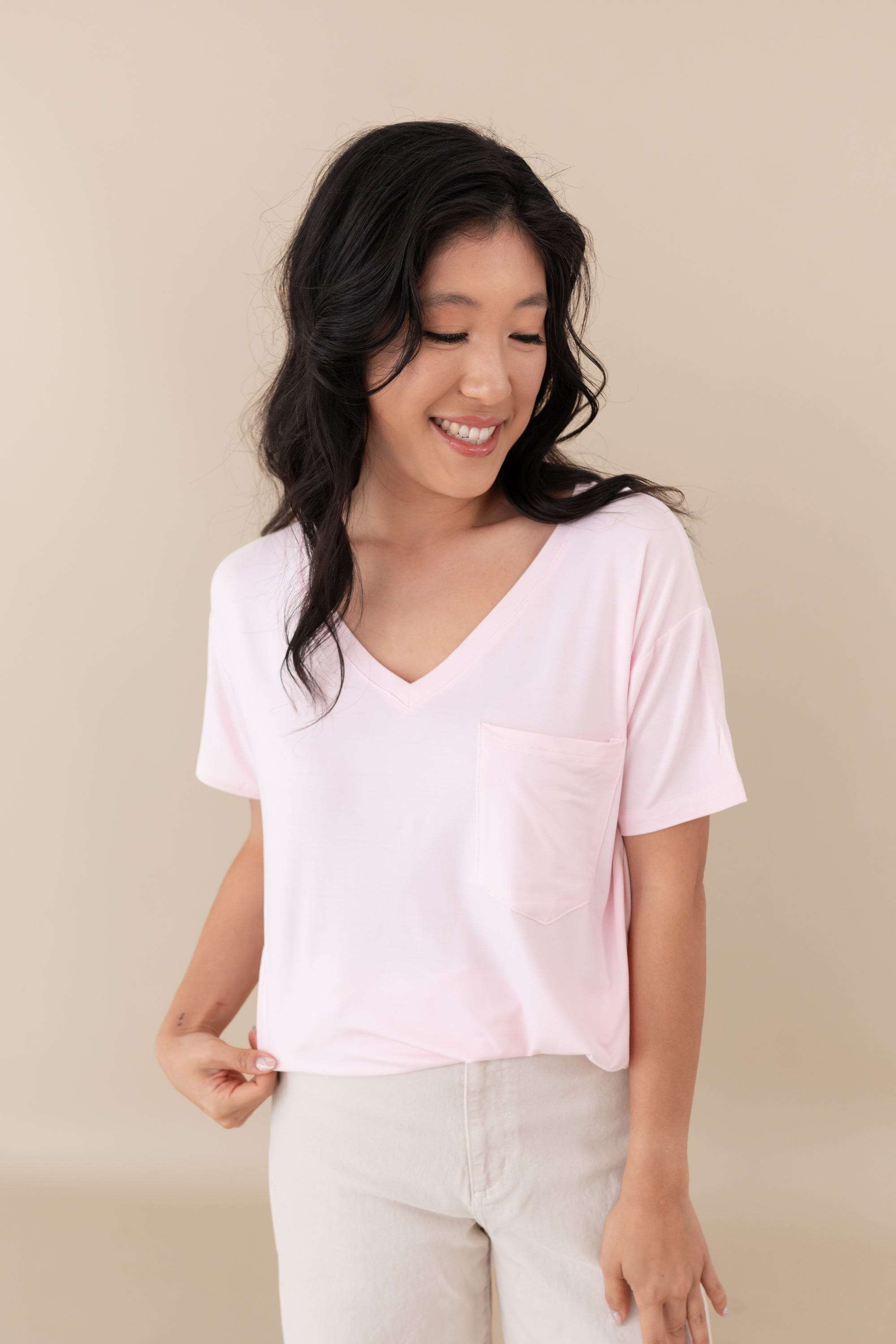 woman modeling Women’s Relaxed Fit V-Neck in Sakura