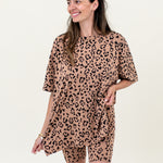 Model wearing leopard print lounge set with biker shorts and an oversized tee