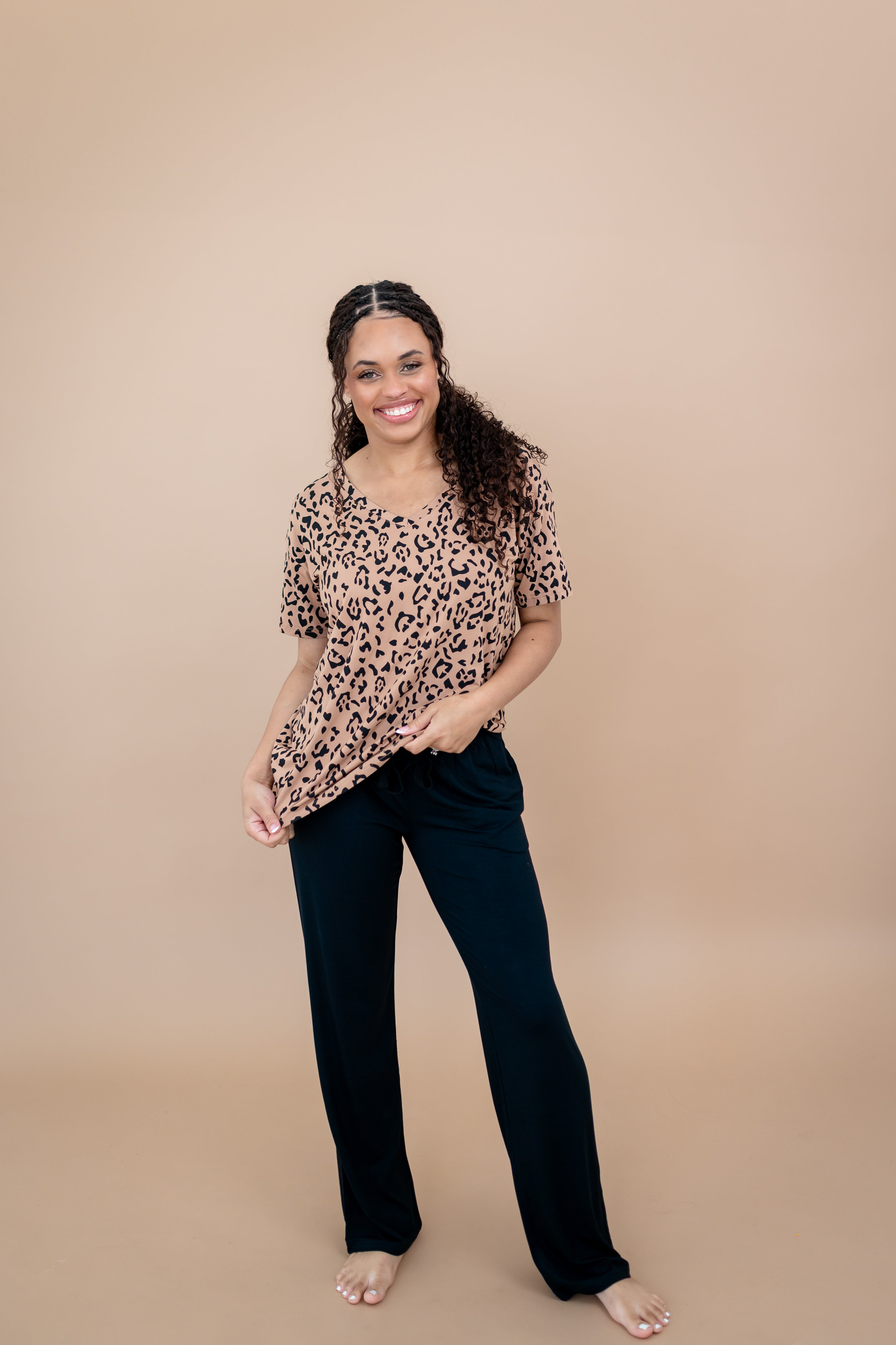 Model wearing the Women's V Neck Tee in Latte Leopard