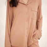 Close up of the button closures and chest pocket of the Long-Sleeved Women's Pajama Set in Latte with Latte Trim shown on a model
