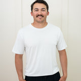 Man modeling Men's Crew Neck Tee in Snow and Midnight Lounge Pants