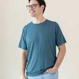Model standing with hand in pocket while wearing the Men's Crew Neck Tee in Atlantic