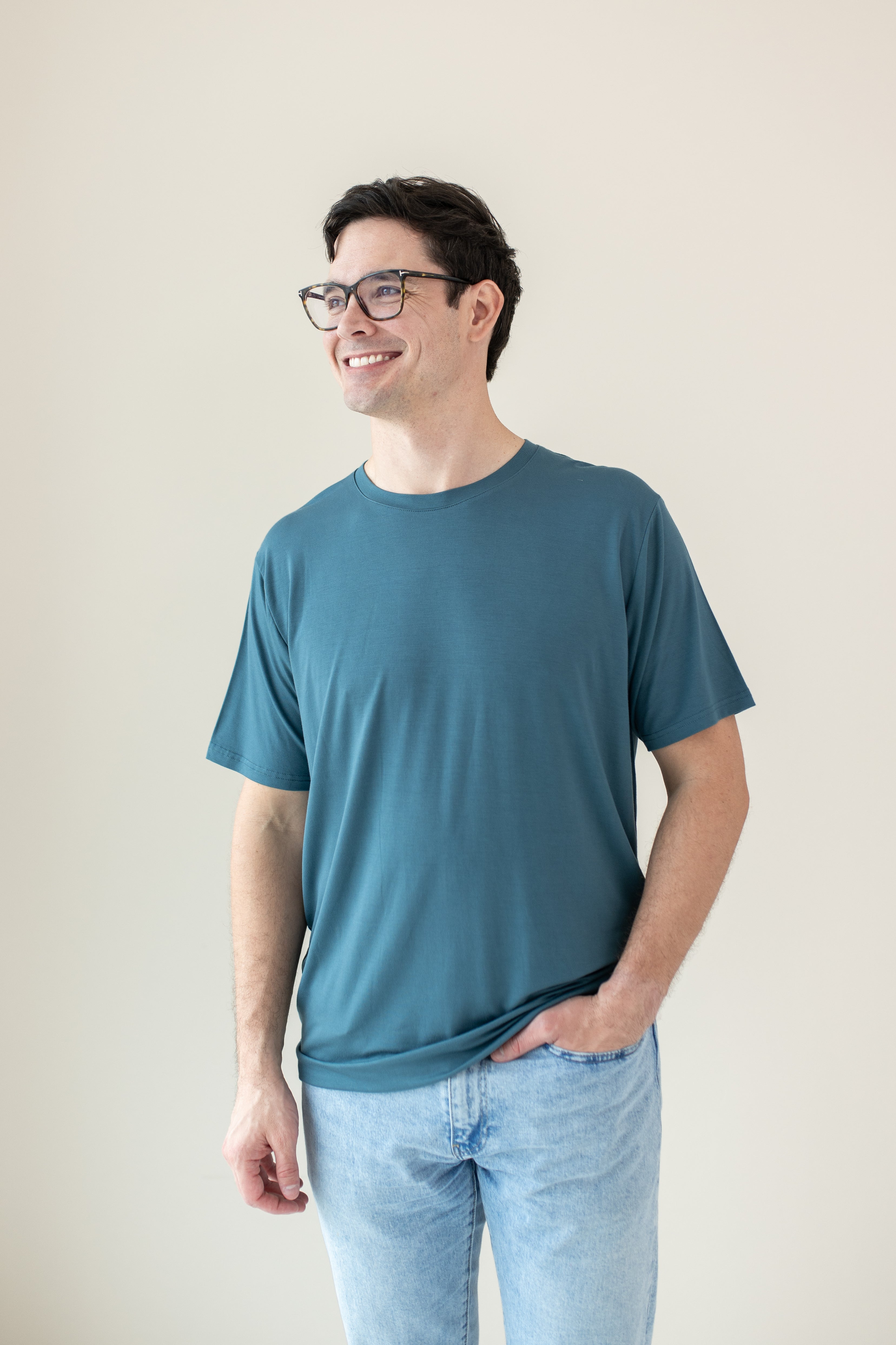 Model standing with hand in pocket while wearing the Men's Crew Neck Tee in Atlantic