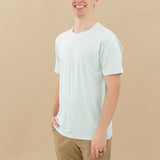 Man modeling Men's Crew Neck Tee in Dew