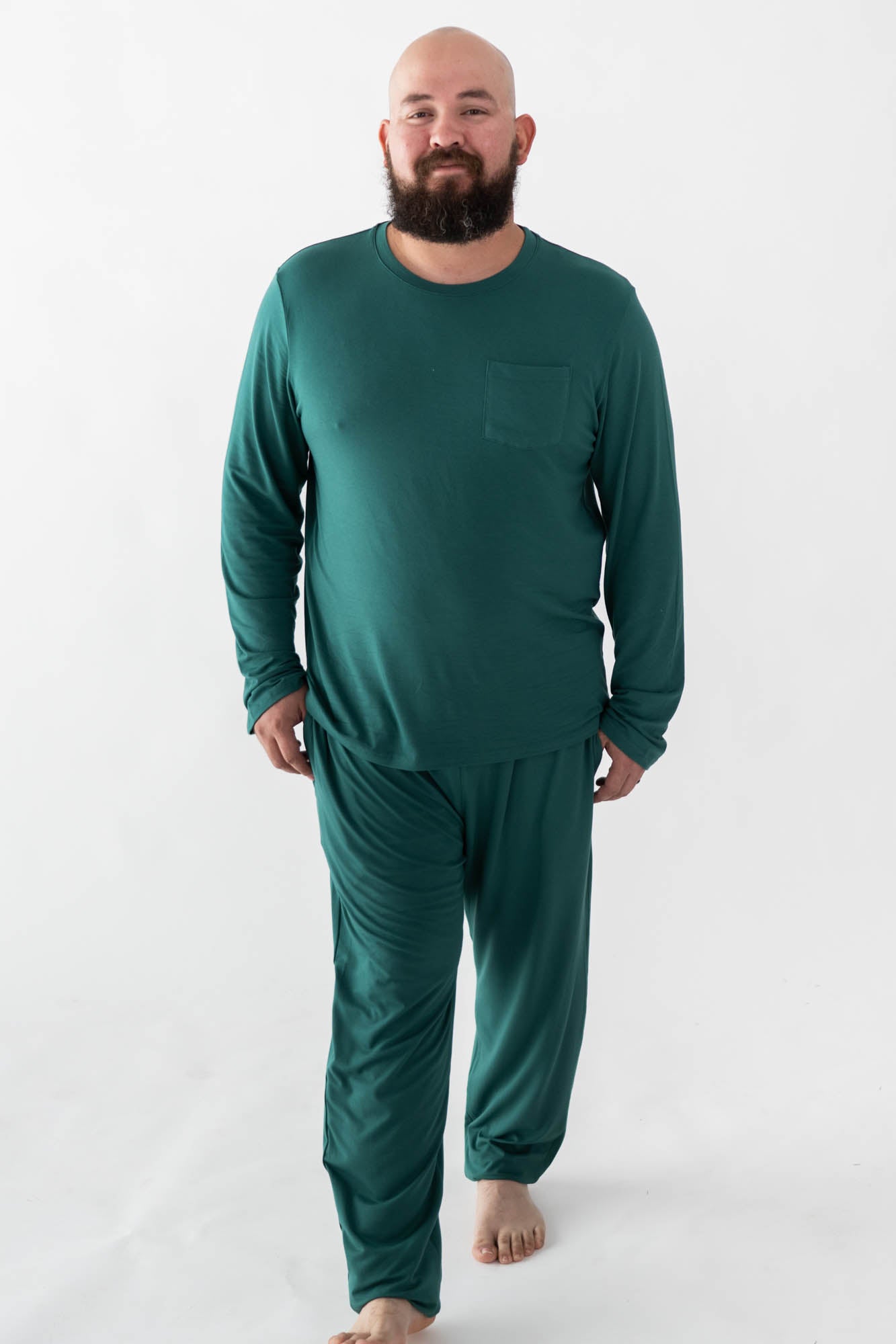 Male model walking wearing the Men's Jogger Set in Emerald