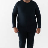 Male model walking wearing the Men's Jogger Set in Midnight