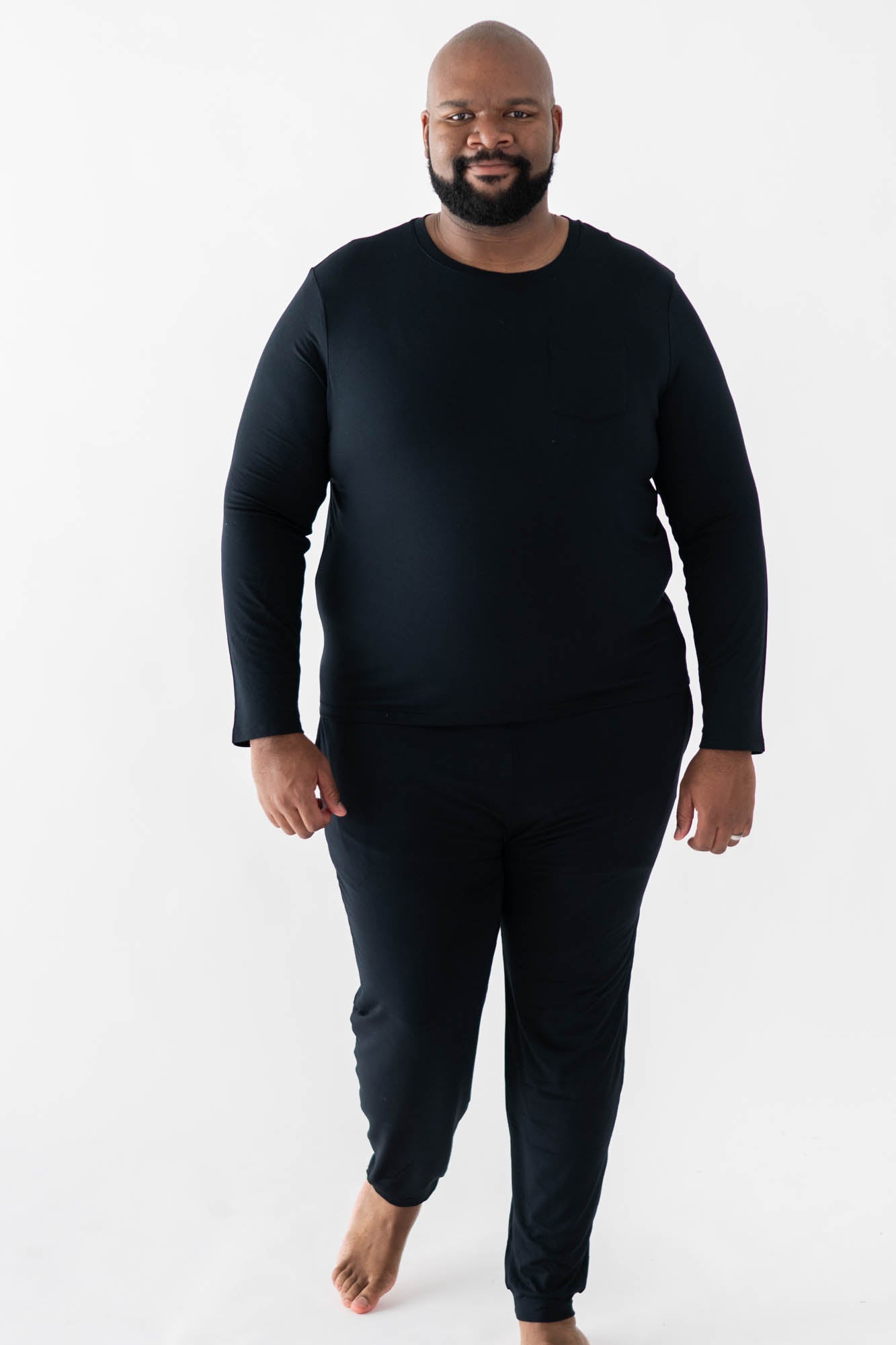 Male model walking wearing the Men's Jogger Set in Midnight