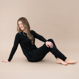 Woman sitting modeling Women's Jogger Pajama Set in Midnight