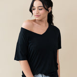 Female wearing the Women’s Relaxed Fit V-Neck in Midnight off the shoulder