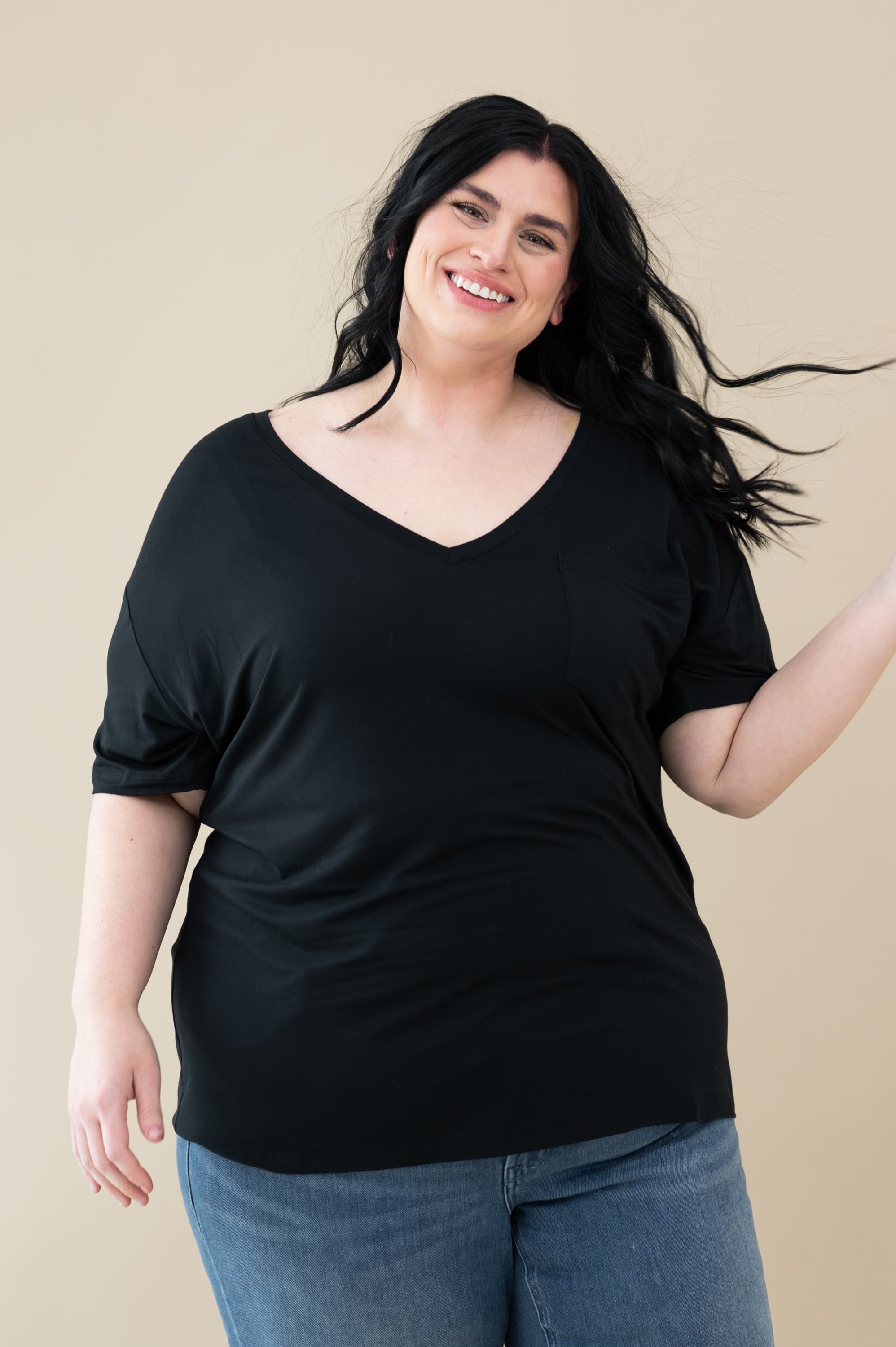 Female model wearing the Women’s Relaxed Fit V-Neck in Midnight