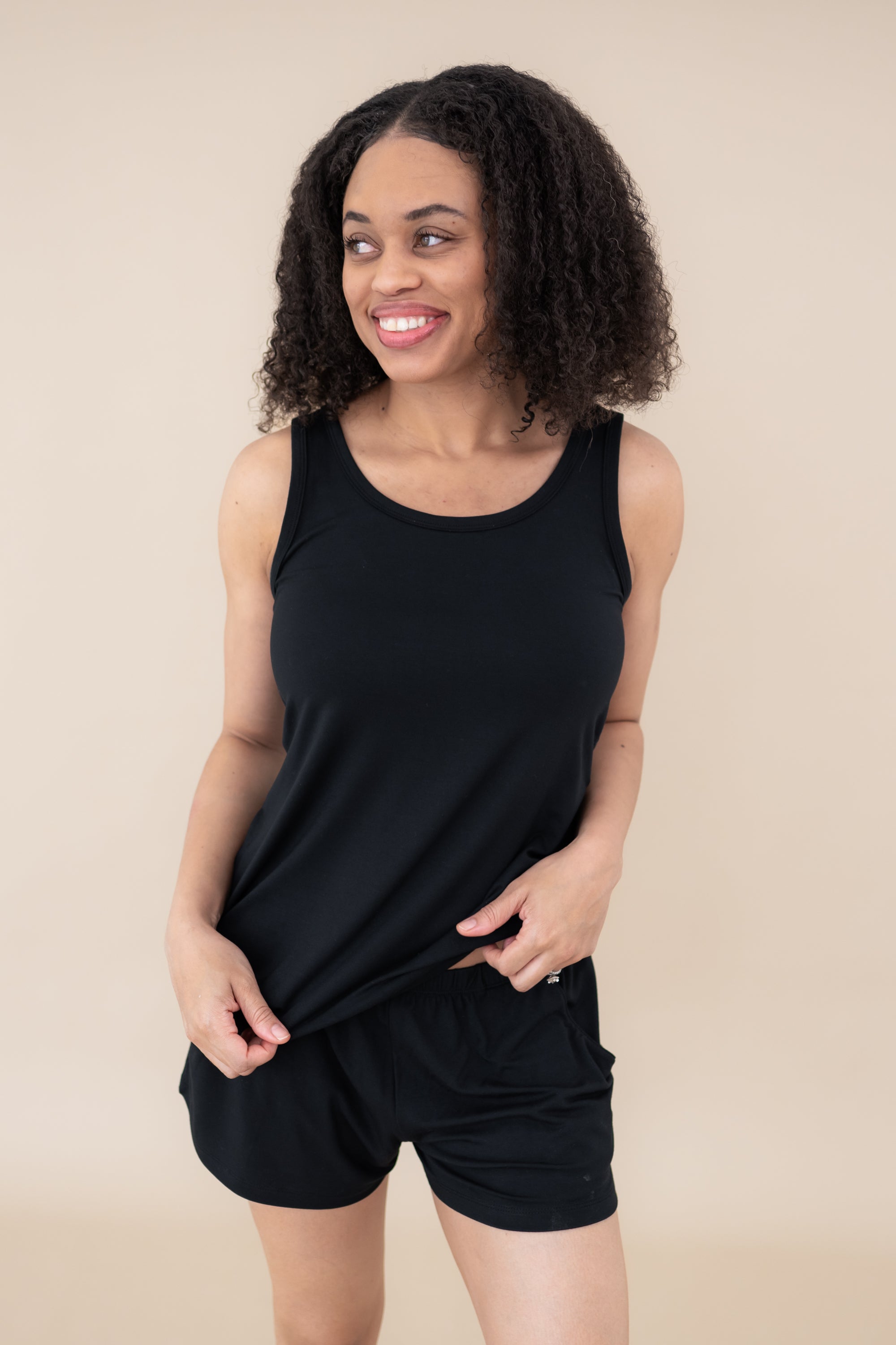 Female model wearing the Women’s Tank Set in Midnight
