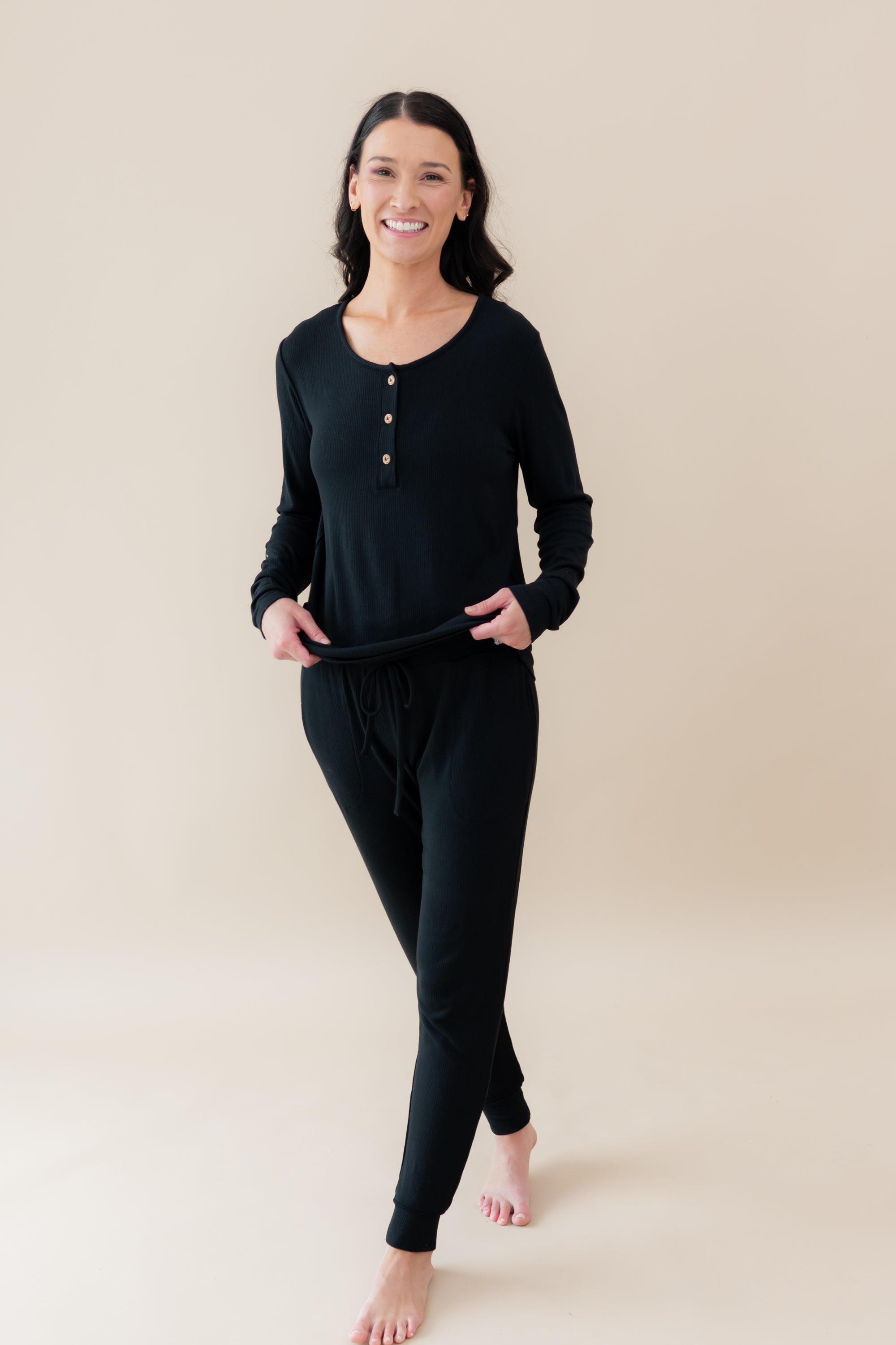 Woman walking smiling wearing Women's Ribbed Jogger Pant in Midnight