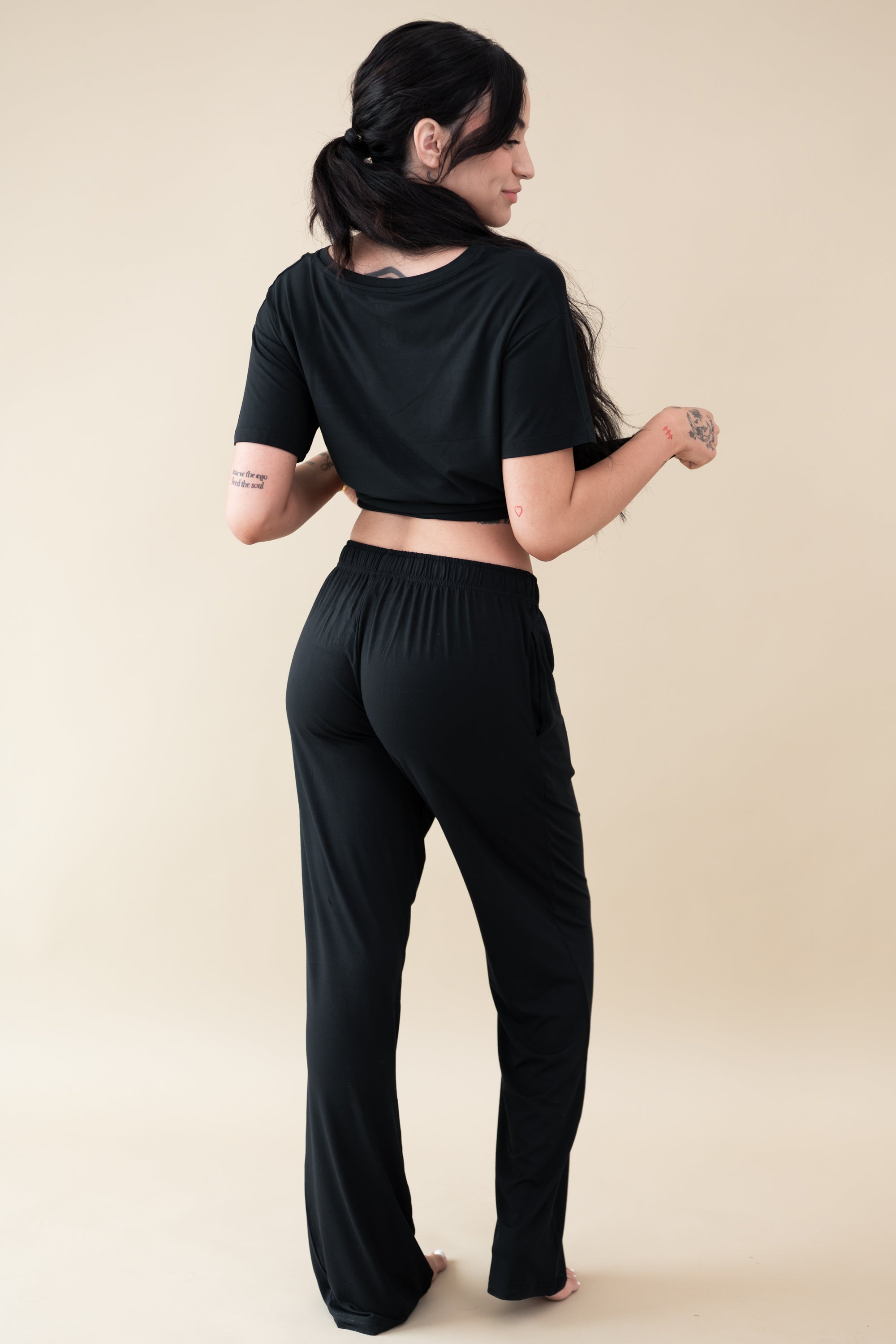 Female modeling the back of the Women's Lounge Pants in Midnight