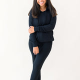 Woman modeling Women's Ribbed Hoodie in Midnight and matching jogger pant