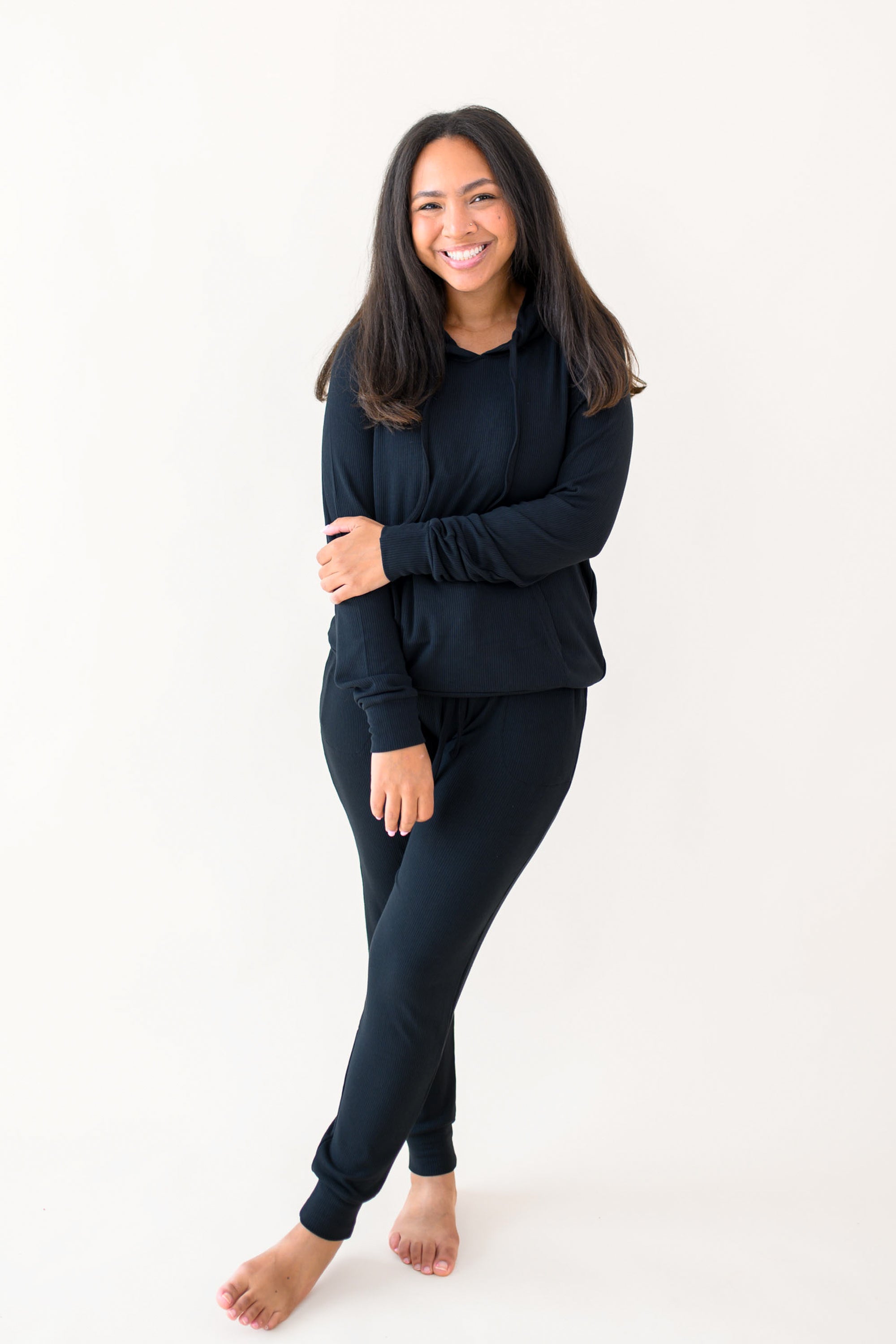 Woman modeling Women's Ribbed Hoodie in Midnight and matching jogger pant