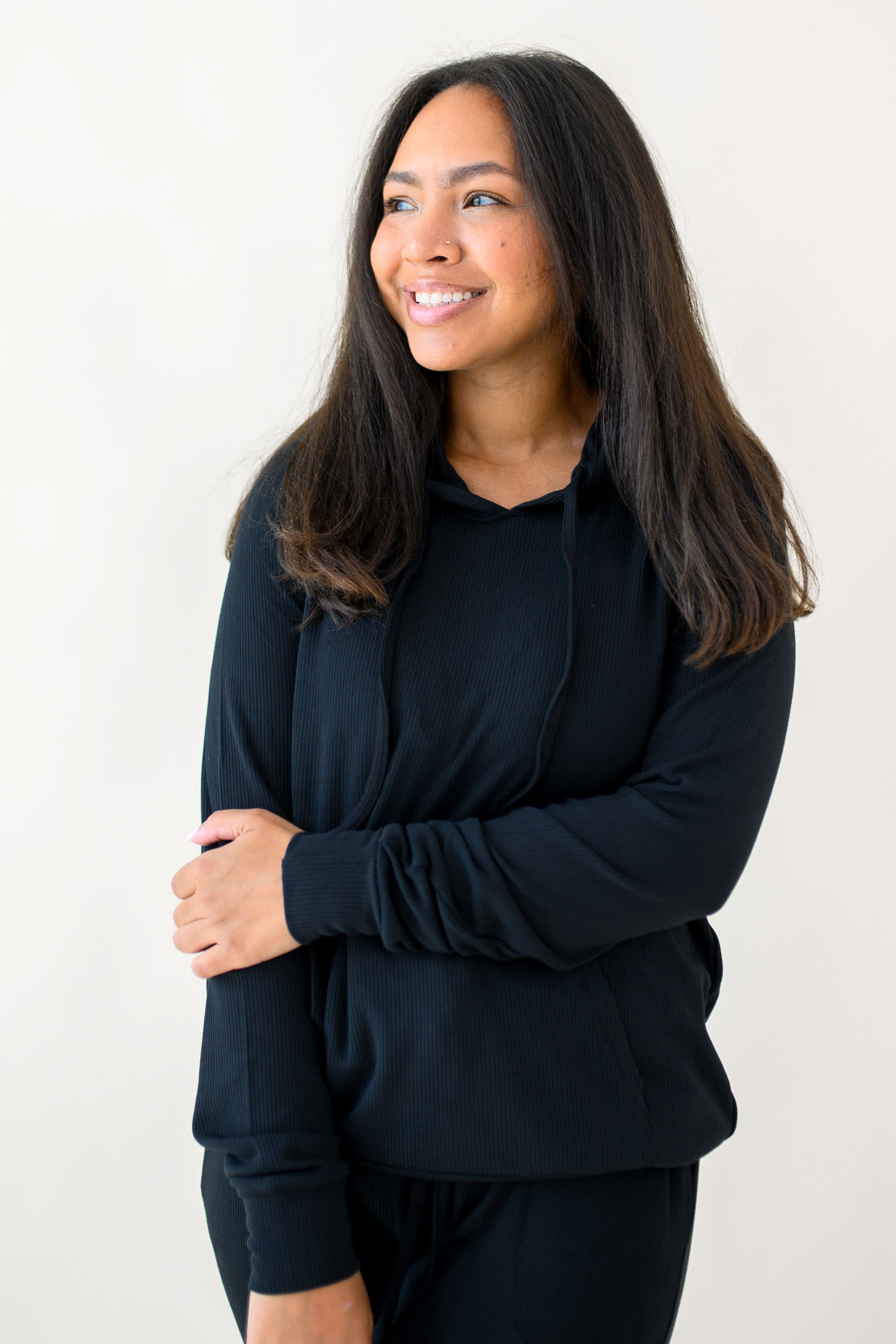 Woman modeling Women's Ribbed Hoodie in Midnight