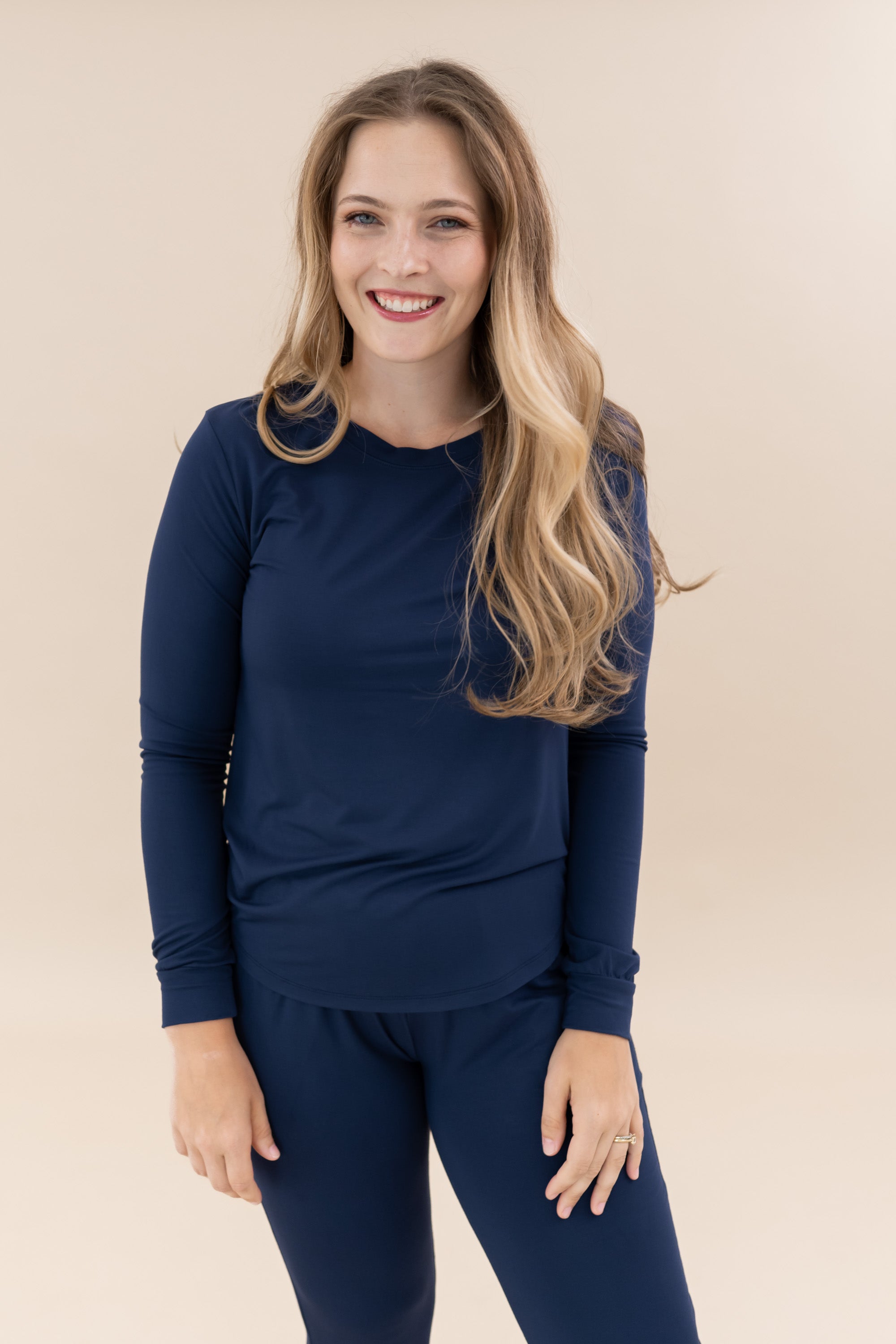 Smiling model wearing the Women's Jogger Pajama Set in Navy