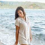 Female model by the ocean wearing Women's Short Sleeve Pajama Set in Oat